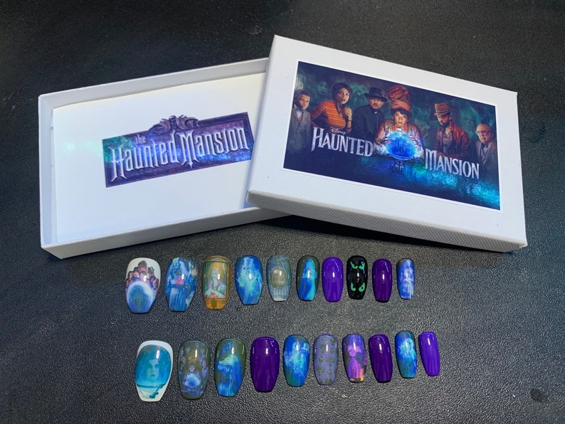 May include: A set of 18 Haunted Mansion themed press-on nails. The nails feature images of ghosts, the mansion, and the text "Haunted Mansion".