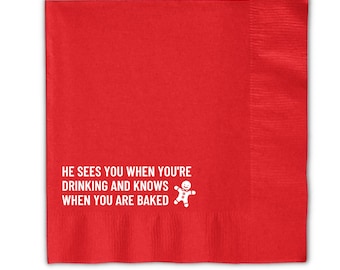 May include: Red paper napkin with white text that reads "He sees you when you're drinking and knows when you are baked." A gingerbread man icon is next to the text.