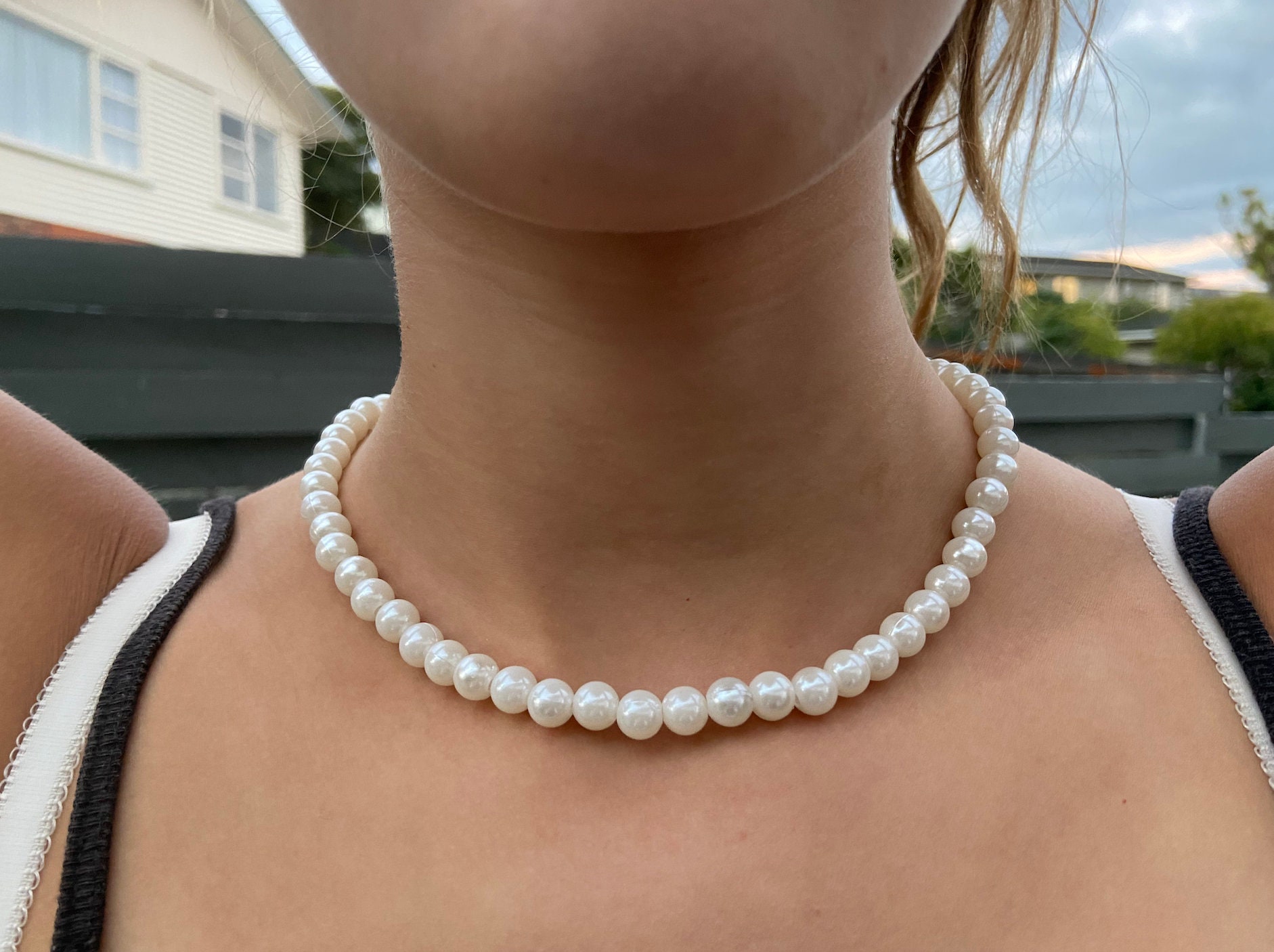 add a pearl necklace