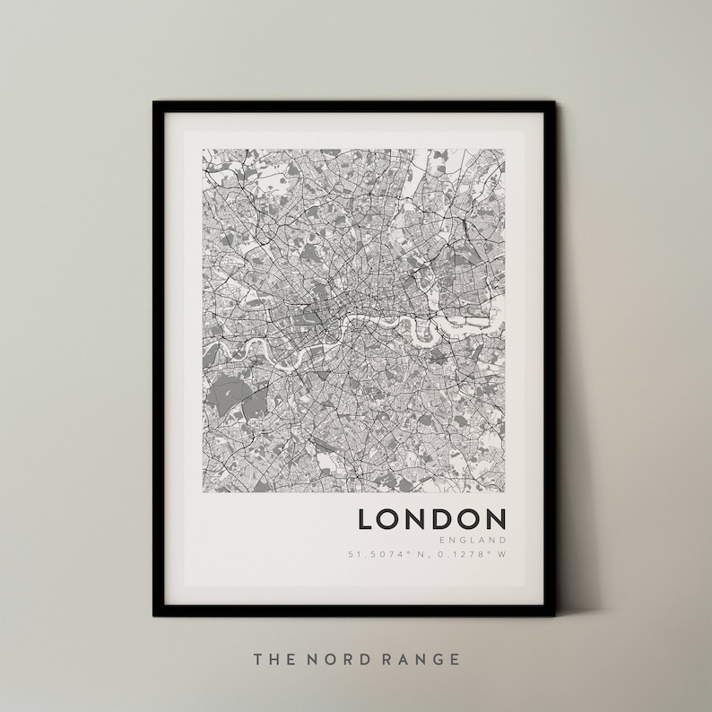 May include: A black and white map print of London, England. The map shows the city's streets and landmarks. The text "LONDON" and "ENGLAND" are printed below the map, along with the coordinates "51.5074&deg; N, 0.1278&deg; W". The text "THE NORD RANGE" is printed below the coordinates.