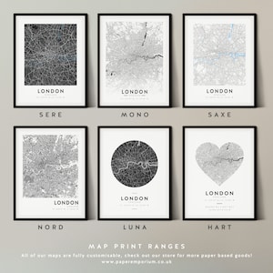May include: Six different styles of London city map prints. The maps are in black and white with a gray background. The maps are framed in black frames. The styles are: Sere, Mono, Saxe, Nord, Luna, and Hart.