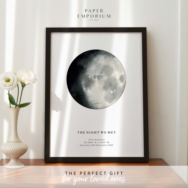 May include: A black and white watercolor illustration of a moon with the text "THE NIGHT WE MET" and the date "Saturday 10th December 2005".