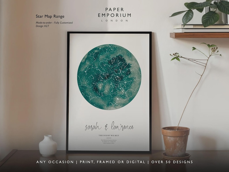 May include: A framed star map print with a teal watercolor background and white constellations. The print includes the names "sarah & lawrence" and the text "THE NIGHT WE MET". The words "Star Map Range" and "Paper Emporium London" are also visible.
