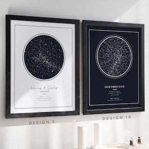 May include: Two framed star maps with black frames. The left map is white with a dark blue circle showing the constellations on the night of a first kiss. The text reads "Harry & Emily, Our First Kiss, Dublin, Ireland, 53.3487&deg; N, 6.2603&deg; W, February 14th, 2023". The right map is dark blue with a white circle showing the constellations on the night of a first date. The text reads "Our First Date, Manchester, England, 53.4807&deg; N, 2.2426&deg; W, July 1st, 2023, Sophie & Adam, Love Lives, New & Forever".