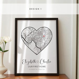 May include: A black and white map of a city in the shape of a heart with the names Elizabeth and Charlie and the text "Our First Home" and the coordinates "31.4543&deg; N, 2.3879&deg; W".