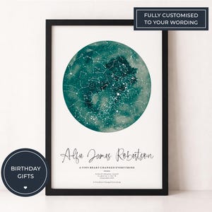 May include: Black framed print with a teal celestial map design. The print features a circular star chart, a name, and the text "A Tiny Heart Changed Everything." A sticker on the left says "Birthday Gifts." The text "FULLY CUSTOMISED TO YOUR WORDING" is at the top.