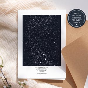 May include: A white card with a dark blue starry night design. The text "THE DAY WE SAID 'I DO' ISLA & BENJAMIN" is printed at the bottom, along with the date and location. A round sticker with the text "FREE DELIVERY INCLUDED FOR EVERY ORDER" is on the right.