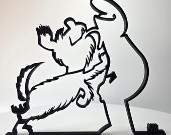 May include: A black, flat, two-dimensional wall art piece featuring a continuous line silhouette of a person standing and interacting with a small, furry dog that is jumping up with its front paws raised toward the person's outstretched hand.