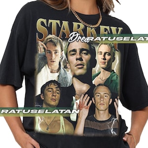 May include: Black t-shirt with a vintage-style graphic print of a band called "Starkey". The graphic features five men with a lightning bolt design.
