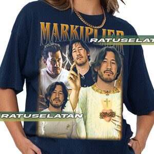 a woman wearing a t - shirt with a picture of two men on it