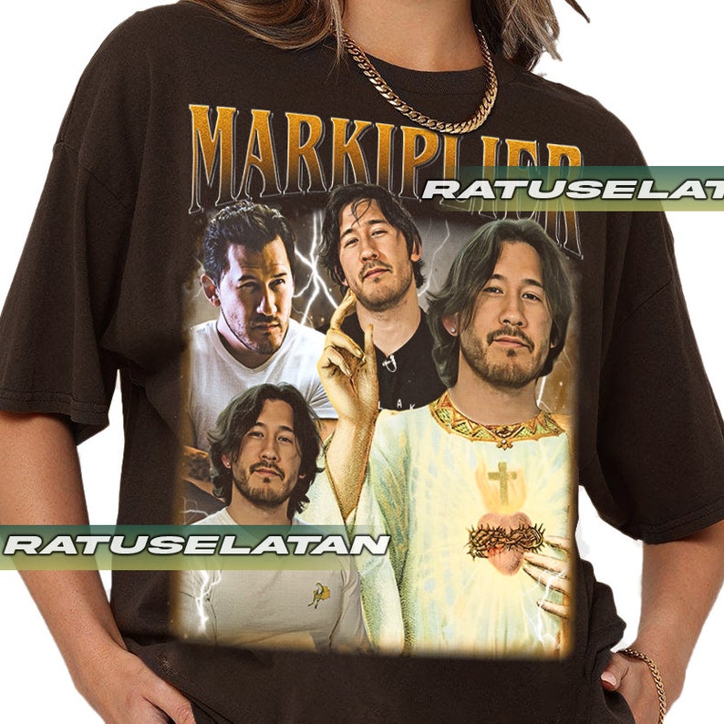 a woman wearing a black shirt with a picture of two men on it