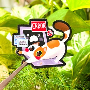 May include: A white and orange cat with a red nose is peeking out of a computer screen. The screen says "ERROR" in red letters and has a skull and crossbones icon. The cat is holding a piece of paper that says "10 volumes order placed..."