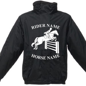 May include: Black jacket with a white silhouette of a rider jumping a fence on a horse. The text "RIDER NAME" and "HORSE NAME" is printed on the jacket.