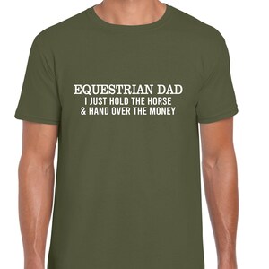 May include: A green t-shirt with white text that reads "Equestrian Dad I just hold the horse & hand over the money"