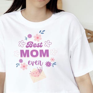 Camiseta &quot;La mejor mamá del mundo&quot;, regalo para el Día de la Madre, linda camiseta floral para mamá, regalo para mamá de parte de los niños, camiseta gráfica para mamá