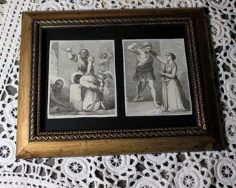 May include: A framed artwork featuring two black and white illustrations. The illustrations depict scenes of historical figures in dramatic poses. The frame is gold-toned with a decorative rope-like border, set against a white lace background.