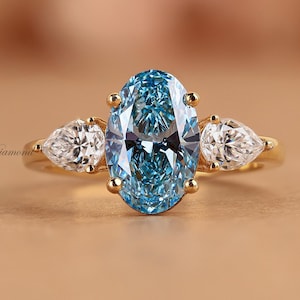 Oval Blue Lab Grown Diamond Ring: Three Stone Engagement Ring