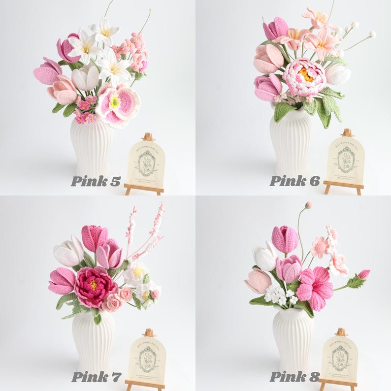May include: Four arrangements of crocheted flowers in white ribbed vases, labeled Pink 5, Pink 6, Pink 7, and Pink 8. Each bouquet features various shades of pink, white, and green yarn-crafted blossoms, buds, and leaves with small wooden display signs.