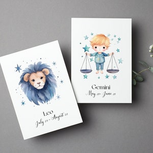 Może przedstawiać: Dwie akwarelowe ilustracje znak&oacute;w zodiaku. Pierwsza ilustracja przedstawia niebieskiego lwa z brązową twarzą i tekstem "Leo July 23 - August 22". Druga ilustracja przedstawia chłopca z blond włosami w niebieskiej koszuli trzymającego wagę. Tekst "Gemini May 21 - June 21" znajduje się pod ilustracją.