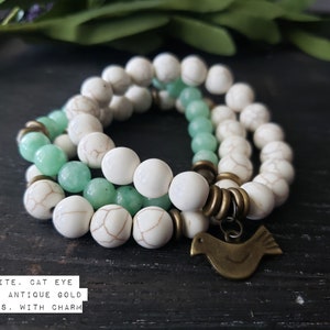 Beaded stretch bracelet; howlite, cat eye glass with antique bronze accents and charm; gemstone, 10mm/8mm (203)