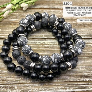May include: Three-strand bracelet set with black jasper, black and white howlite, and lava beads. The beads are interspersed with silver accents. The bracelet set is labeled "220-1 8MM/10MM BLACK JASPER, BLK/WHT HOWLITE, LAVA WITH SILVER ACCENTS (STACK 220) DIFFUSER SET".