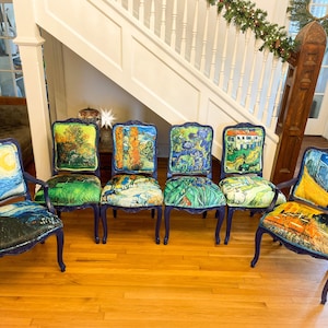 May include: Six blue chairs with wooden legs and backs are arranged in a row. Each chair is upholstered with a different famous painting by Vincent van Gogh, including "Starry Night", "The Starry Night Over the Rhone", and "Irises".