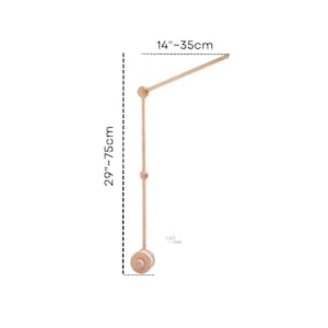 May include: Wooden baby mobile arm with a 75cm height and a 35cm arm length. The arm is made of natural wood and has a simple design.