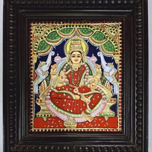 Gajalakshmi Tanjore painting with 22K gold foil and teakwood frame 15x13 Inch, depicting Goddess Lakshmi with elephants for pooja room decor