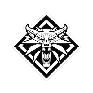 May include: Black and white sticker featuring a stylized wolf head within a diamond shape. The wolf has an open mouth with visible teeth and is surrounded by geometric lines. The design is bold and graphic.