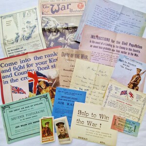 May include: A selection of historical World War I documents, including newspapers, pamphlets, and postcards. The items feature patriotic imagery, military personnel, and wartime guidance. The color scheme includes beige, blue, and red hues.