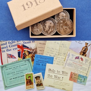 May include: A display of historical items from 1918, including coins, postcards, and printed ephemera. The collection features text and imagery related to World War I, with a focus on British themes and historical events.