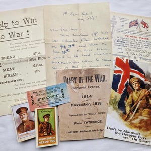 May include: A selection of historical World War I documents, including posters, handwritten letters, and tickets. The items feature patriotic themes, rationing advice, and military imagery. The color palette is muted with sepia tones.