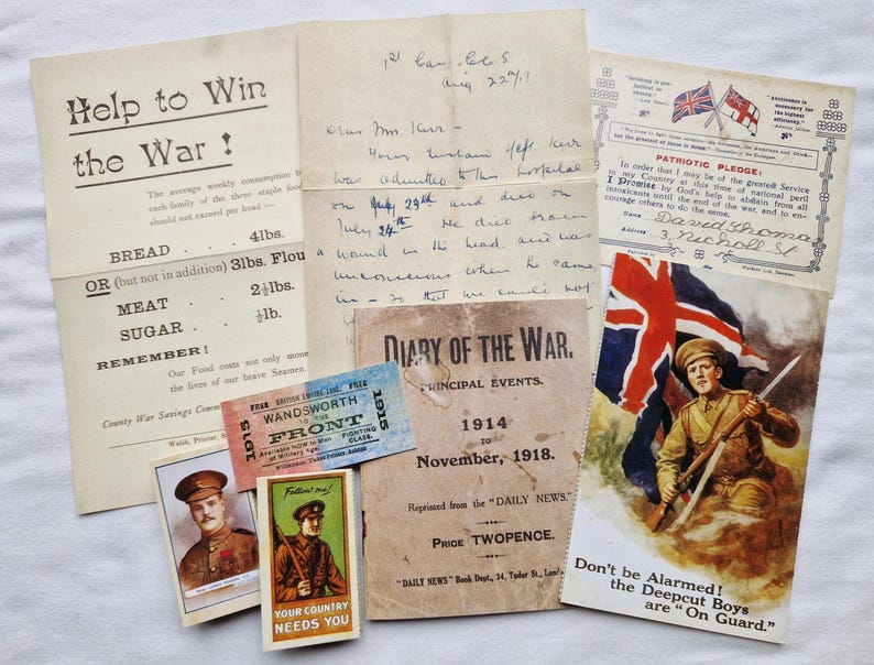 May include: A selection of historical World War I documents, including posters, handwritten letters, and tickets. The items feature patriotic themes, rationing advice, and military imagery. The color palette is muted with sepia tones.