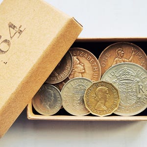 Caixa de moedas de aniversário de 1964