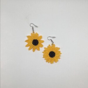 Yellow sunflower lace earrings crafted with vibrant embroidery thread to make a stunning addition to any outfit, adding a feminine and delicate touch. These earrings are super lightweight, unique, and make a wonderful gift for any occasion. The hypoallergenic French ear wire hooks and jump rings are made from stainless steel and include clear silicone earring backs. Measurements: Refer to Size / Select an option