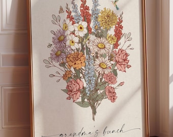 May include: A framed print featuring a colorful floral bouquet illustration. The artwork includes daisies, roses, and other flowers in shades of pink, yellow, and blue. The text "grandma's bunch" is written in cursive, with names listed below.