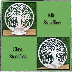 May include: Two wooden, circular tree of life decorations. One is on a stand, the other without. Each features a name and the number 60, with text below. The background is green.