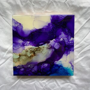 May include: Abstract painting on canvas featuring purple, blue and white colours. The painting has a fluid, organic style with swirling patterns.