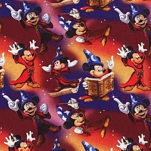 May include: A repeating pattern of Mickey Mouse dressed as a sorcerer. He is wearing a red robe, a blue hat with a crescent moon, and holding a magic wand. He is flying on a cloud with a book in his hand. The background is a red, orange, and purple gradient with stars.
