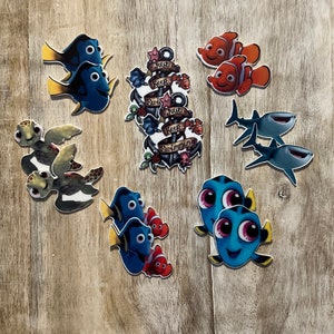 May include: A set of 10 colorful iron-on patches featuring characters from the animated film Finding Dory. The patches include Dory, Nemo, Marlin, Hank, and Crush. The patches are perfect for adding a touch of Disney magic to your clothing, bags, or other accessories.