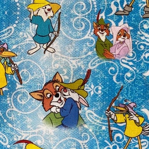 May include: A fabric featuring a repeating pattern of characters from the animated film "Robin Hood." The characters include Robin Hood, Little John, and Maid Marian, set against a light blue background with a white swirl design.