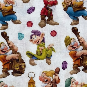 May include: A fabric design with a repeating pattern of the Seven Dwarfs from Snow White. The cartoon characters are shown in various poses, some playing musical instruments. Gemstones and a lantern are scattered across a white background.