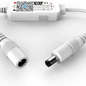 May include: A white WiFi LED controller with two white cables and connectors. The controller has the text "WIFI LED CONTROLLER" and a QR code. The connectors are a female and male DC power connector.