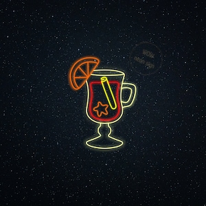 May include: Neon sign of a warm beverage in a glass mug with a handle, featuring a slice of orange, a cinnamon stick, and a star. The sign is outlined in yellow and red, with the text "WOW neon sign" in a circle.