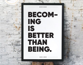May include: Black and white printable poster with the text "Becoming is better than being." and the name "Carol S. Dweck" at the bottom. The poster is framed and sitting on a wooden stool.