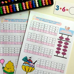 May include: A pink and white worksheet with a colorful ice cream cone illustration and a math problem that reads "3+6= ". The worksheet is titled "Addition and Subtraction Practice, No Formulas Single Digit". There is a pink abacus with beads in the background.