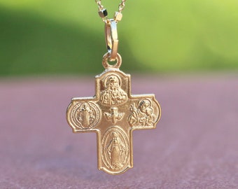 May include: A gold-toned pendant necklace with a five-sided cross charm. The cross features images of saints and religious symbols.