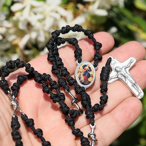 Our Lady Undoer of Knots rosary beads |Parcord rosary , lightweight rosary | Hand made rosary, Woven knot rosary beads, black rosary