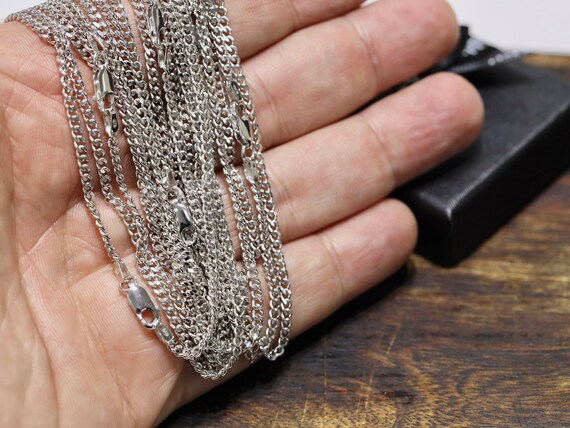 スターリングシルバー ロジウムメッキ カーブチェーン：ダイヤモンド