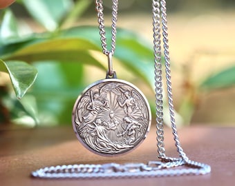 樹脂と金属で作られた大天使聖ガブリエルのヴィンテージメダル - Etsy 日本